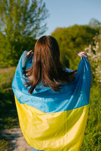 Rear view of woman with umbrella