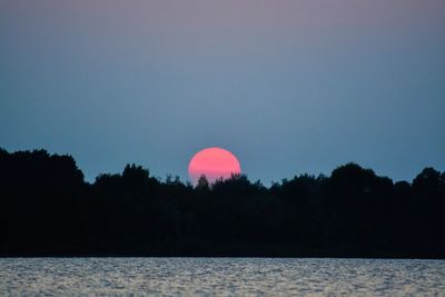 Scenic shot of calm lake against sky