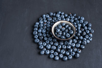 High angle view of blueberries in bowl on table