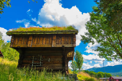 House on field against sky