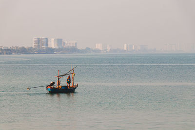 Ship in sea against clear sky