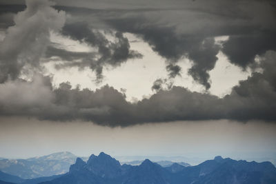 Scenic view of silhouette mountains against sky