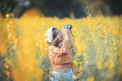 Couple kissing on field