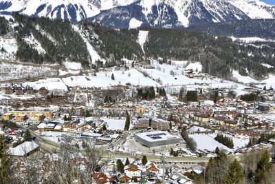 High angle view of townscape and snowcapped mountain