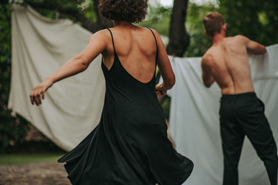 Rear view of couple standing outdoors