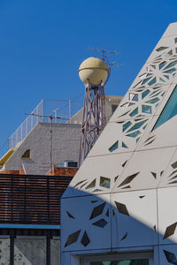 Low angle view of building against blue sky