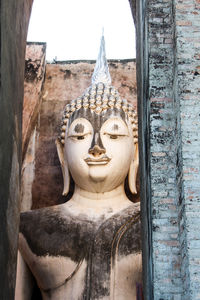 Close-up of statue against temple