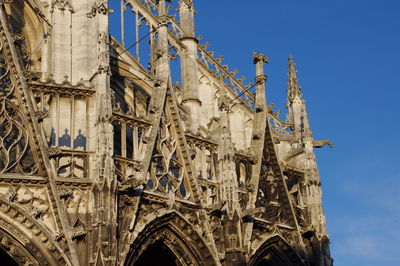 Low angle view of traditional building against blue sky