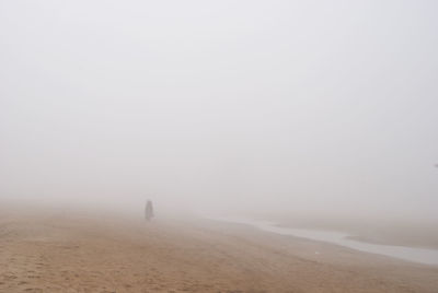 Scenic view of land against sky during winter