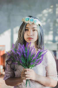 Portrait of a beautiful young woman standing outdoors