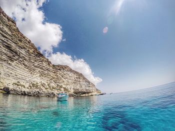 Scenic view of sea against cloudy sky