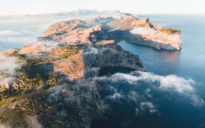 Scenic view of sea and rocks against sky