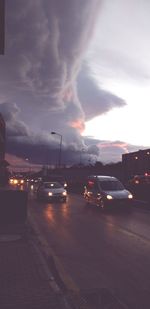 Cars on road at sunset