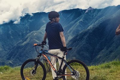 Man riding bicycle on mountain