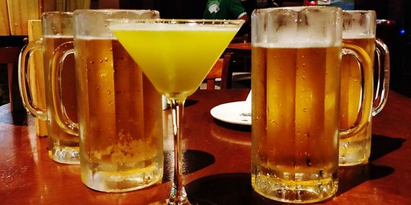 Close-up of beer glass on table