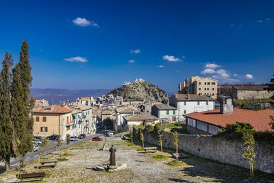 Buildings in town against sky