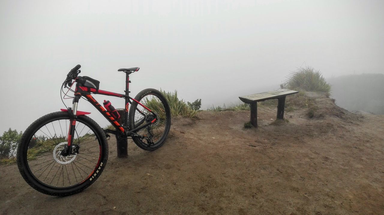 bicycle, transportation, land vehicle, mode of transport, stationary, parking, parked, cycle, tranquility, tranquil scene, day, non-urban scene, scenics, sky, nature, outdoors, footpath, tourism, no people, park, the way forward