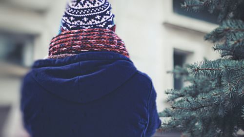 Rear view of person wearing hat during winter