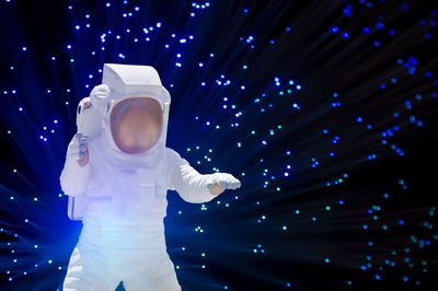Astronaut toy against fiber optics