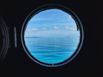 Scenic view of sea seen through window