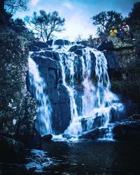 View of waterfall in forest