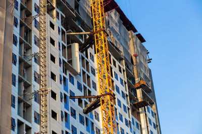 Low angle view of building against blue sky