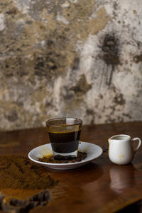 Close-up of coffee cup on table