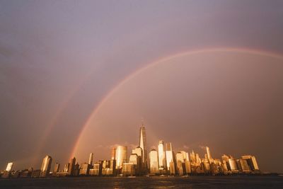 View of rainbow over city