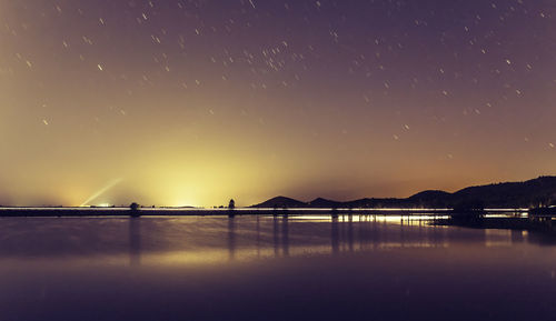 Scenic view of sea against sky at night