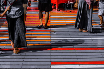 Low section of people standing on street