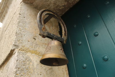 Close-up of padlock on rusty metal