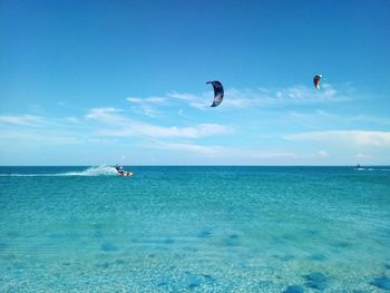 Scenic view of sea against blue sky