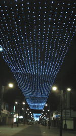 Low angle view of illuminated street light at night