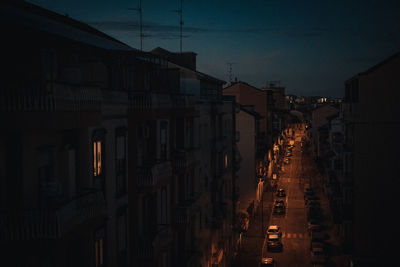 Panoramic view of city street and buildings at night