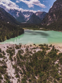 Scenic view of lake and mountains against sky at dürrensee in the dolomites