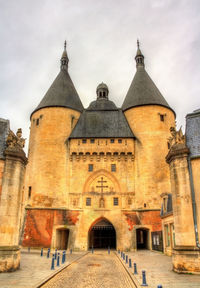 View of historic building against cloudy sky