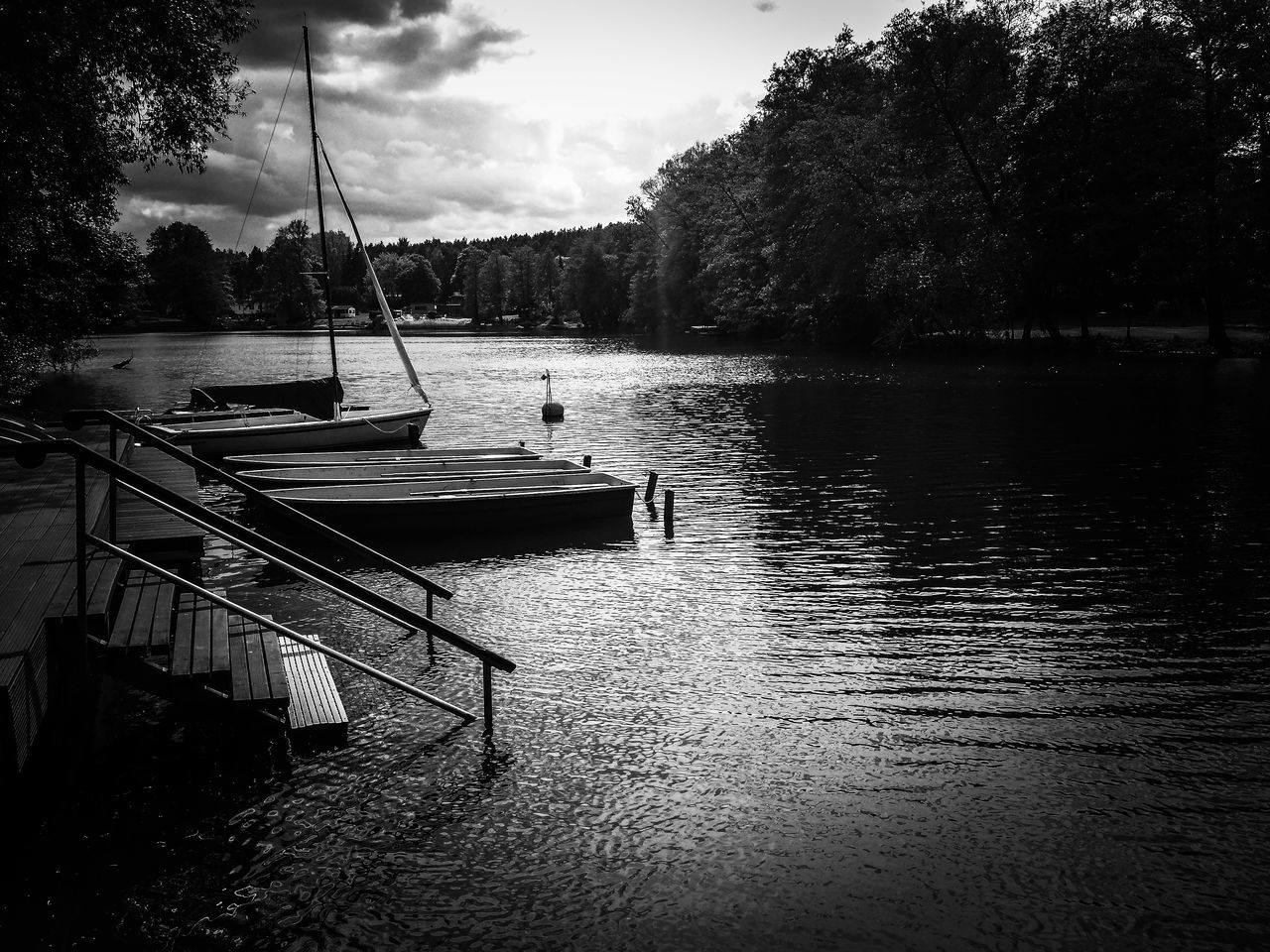 water, transportation, tree, nautical vessel, mode of transport, boat, sky, moored, tranquility, lake, tranquil scene, river, nature, reflection, cloud - sky, scenics, waterfront, beauty in nature, rippled, outdoors