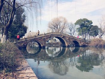 Bridge over river against sky