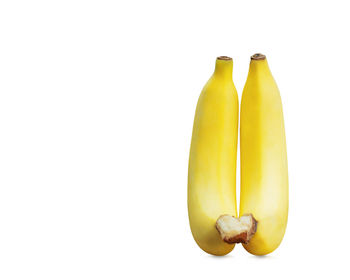 Close-up of bananas against white background