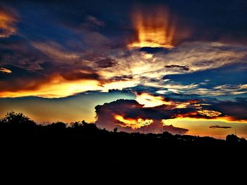 Scenic view of dramatic sky during sunset