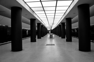 Columns in row at empty subway station