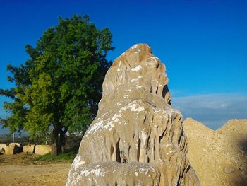 Scenic view of rock formation against blue sky