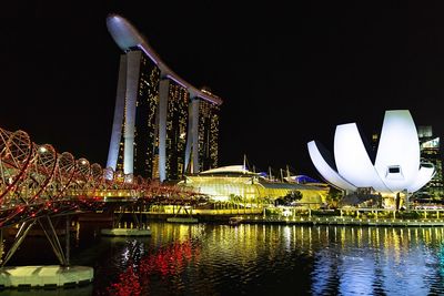 Illuminated marina bay buildings in city at night singapore