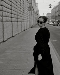 Rear view of woman walking on street