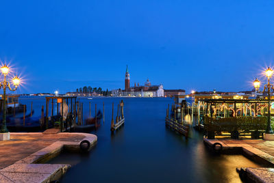 St marks square by grand canal against clear blue sky at dusk