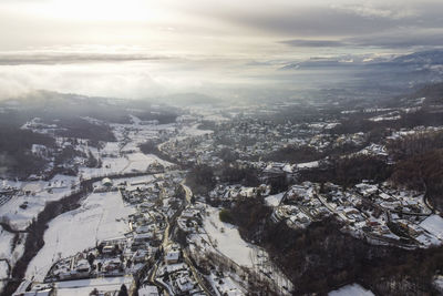 Aerial view of townscape against sky during sunset