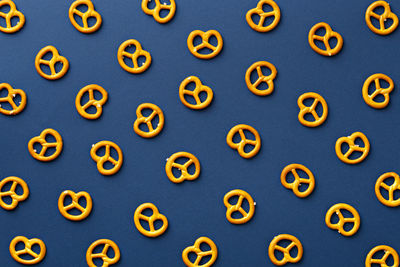 Close up of pretzels on blue background