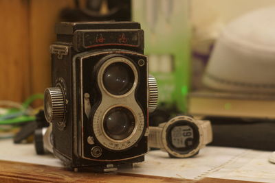 Close-up of camera on table