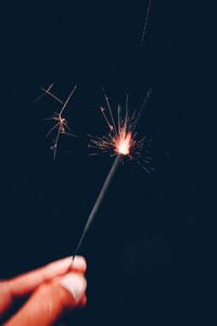 Low angle view of firework display at night