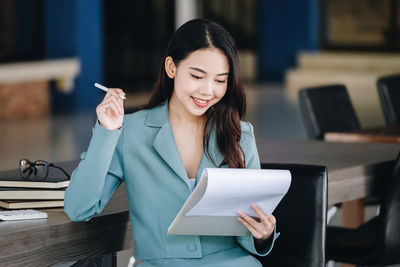 Young woman using mobile phone